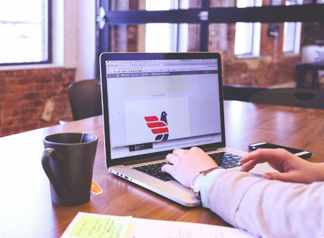 Man Using Laptop On Table